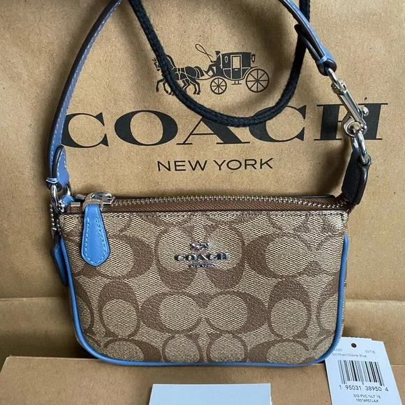Coach Wristlet NWT. Brand New come with gift box&paper bag. 😊 Price is Firm😊 - Picture 7 of 12